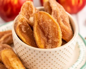 Crispy Air Fryer Apple Fries with cinnamon sugar coating and dipping sauce.